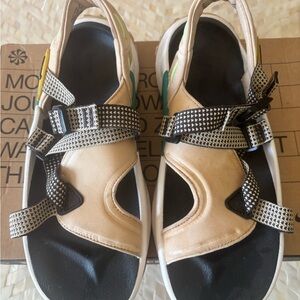 Beige and Black Nike Sandals with Patterned Straps